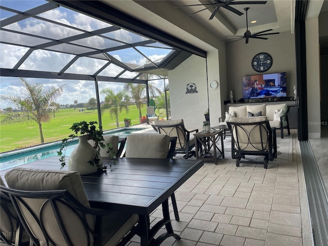 view of patio / terrace with glass enclosure and ceiling fan