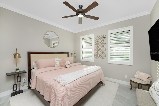 bedroom with ceiling fan and ornamental molding