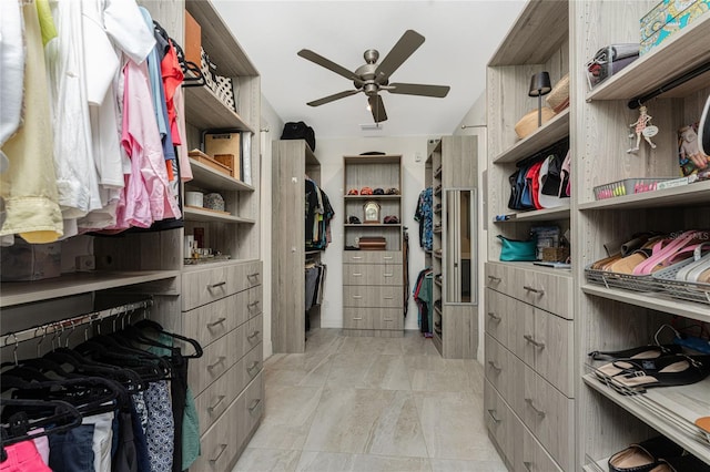 walk in closet with ceiling fan