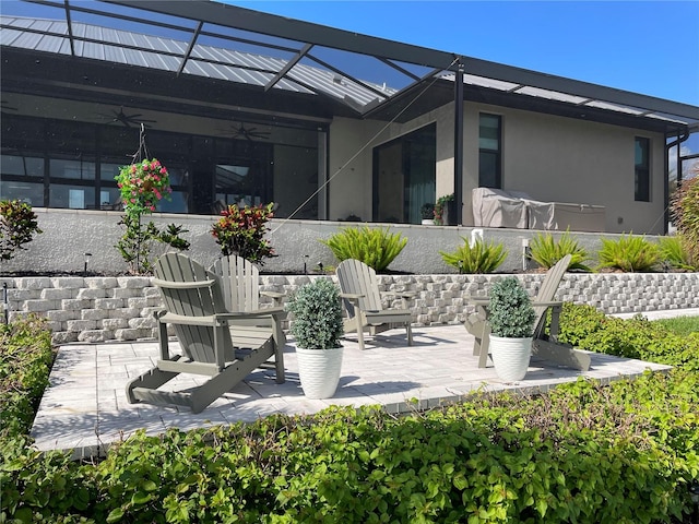 view of patio with a lanai