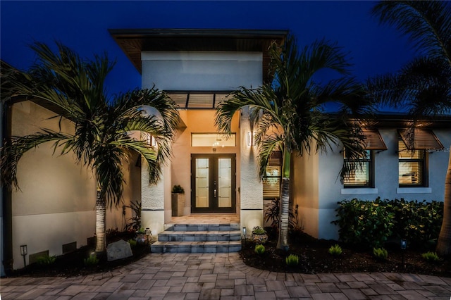 exterior entry at night with french doors