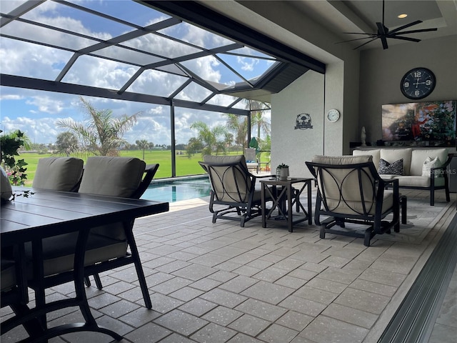 view of patio with a lanai and ceiling fan