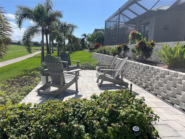 view of patio / terrace with a lanai