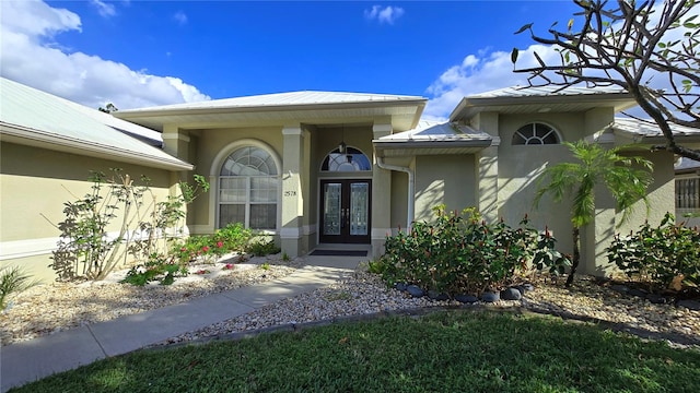 entrance to property featuring french doors