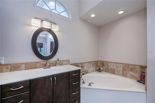 bathroom featuring vanity and a bathtub