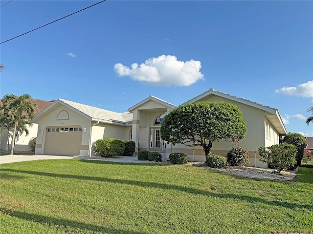 single story home with a garage and a front lawn