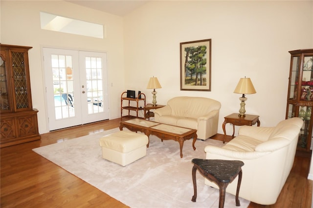 living area featuring hardwood / wood-style floors and french doors