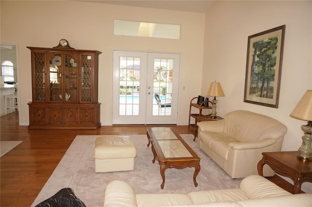 living room featuring french doors and wood-type flooring