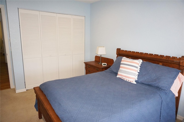 carpeted bedroom with a closet