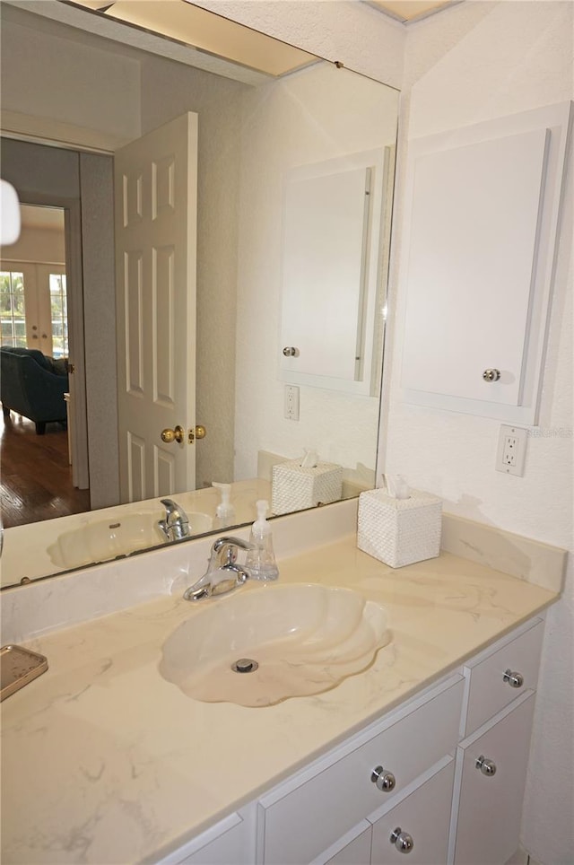 bathroom featuring vanity and hardwood / wood-style floors