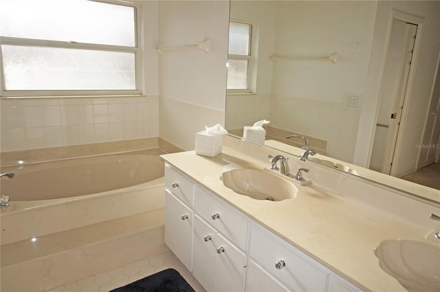 bathroom with vanity, tile patterned floors, and a bathing tub