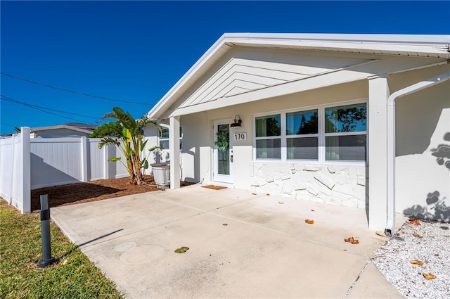 170 Chelsea Ct NW, Port Charlotte, FL 33952 - view of front of property featuring a patio area and stone siding