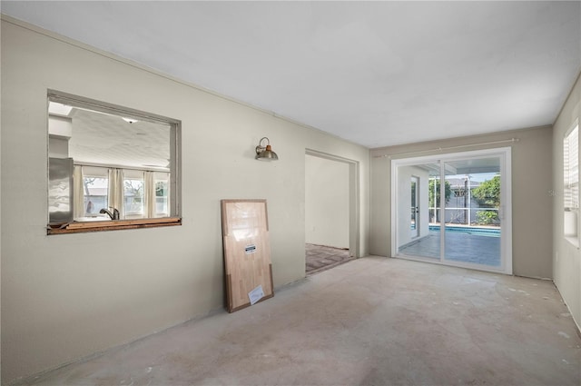 170 Chelsea Ct NW, Port Charlotte, FL 33952 - empty room with unfinished concrete flooring