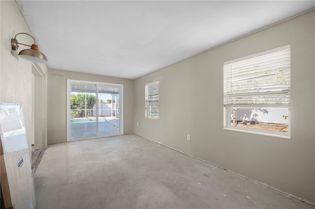 170 Chelsea Ct NW, Port Charlotte, FL 33952 - empty room with concrete flooring