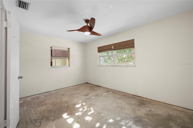 empty room featuring ceiling fan