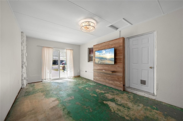 170 Chelsea Ct NW, Port Charlotte, FL 33952 - unfurnished living room featuring attic access and concrete flooring