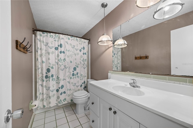 bathroom with tile patterned floors, a shower with curtain, a textured ceiling, vanity, and toilet