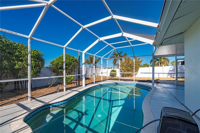 view of pool featuring a lanai and a patio