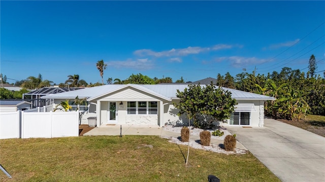 ranch-style home featuring a front yard