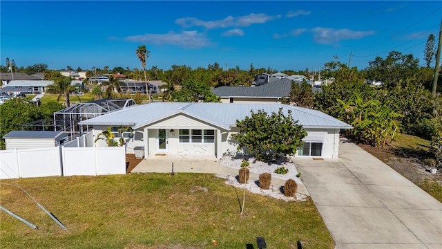 170 Chelsea Ct NW, Port Charlotte, FL 33952 - view of front facade featuring a metal roof and concrete driveway