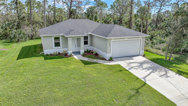 single story home featuring a garage and a front lawn