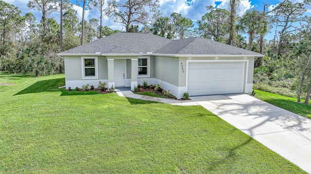 ranch-style home featuring a front lawn and a garage