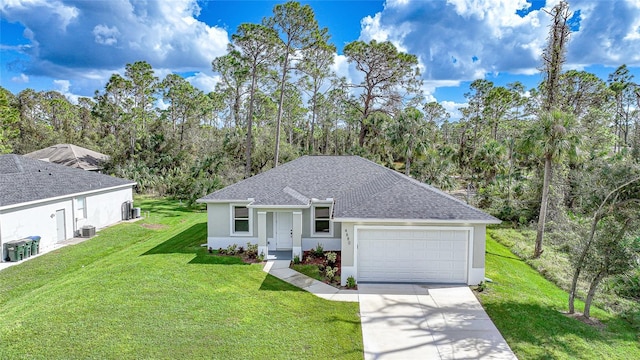 view of front of house featuring a garage and a front lawn