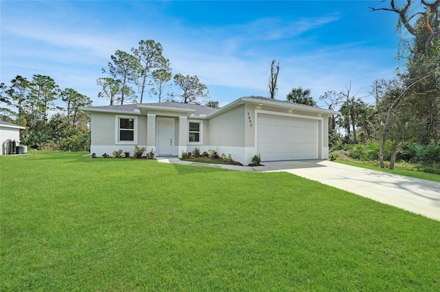 ranch-style house featuring a garage and a front lawn