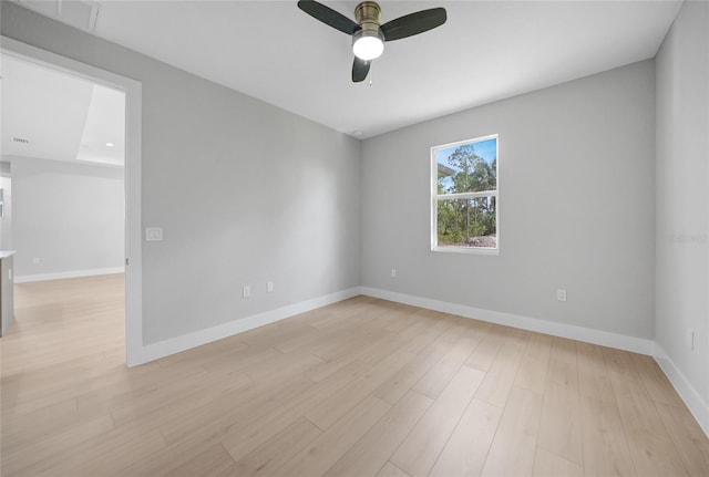 spare room featuring light hardwood / wood-style floors and ceiling fan