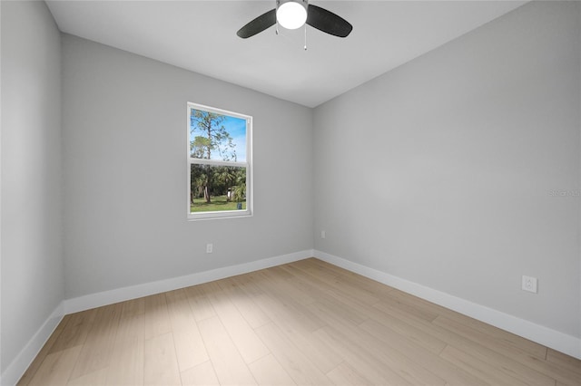 spare room featuring ceiling fan and light wood-type flooring