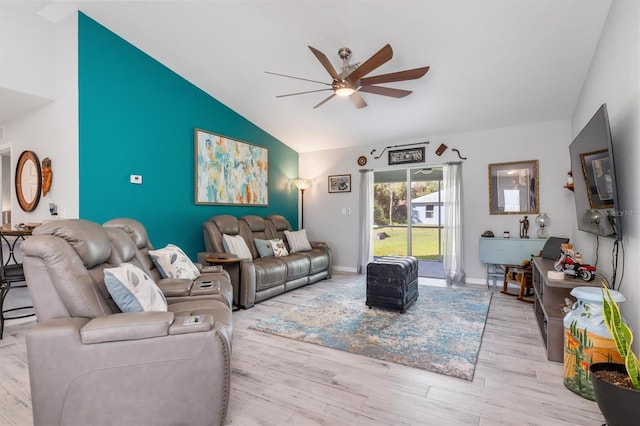 living room with ceiling fan, lofted ceiling, and light hardwood / wood-style floors