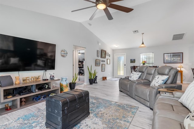 living room with vaulted ceiling, ceiling fan, and light hardwood / wood-style floors