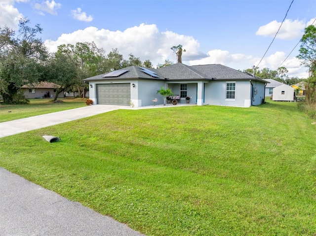 ranch-style house with a garage, a front lawn, and solar panels