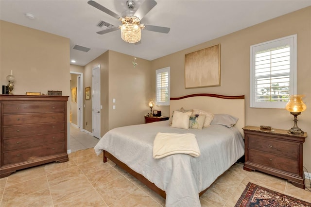 bedroom with light tile patterned floors and ceiling fan