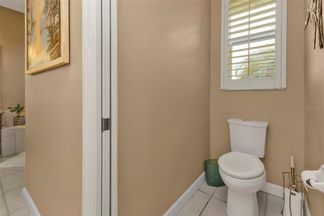 bathroom featuring tile patterned floors and toilet