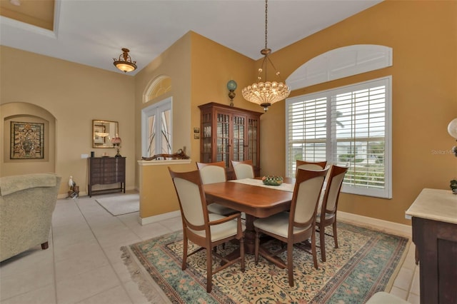 dining room featuring an inviting chandelier and light tile patterned floors