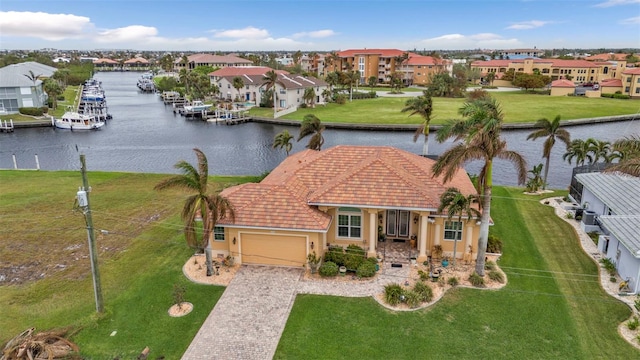 birds eye view of property with a water view