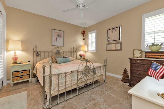 bedroom featuring light tile patterned floors and ceiling fan