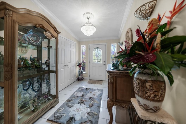 entryway featuring a textured ceiling, light tile patterned floors, and crown molding