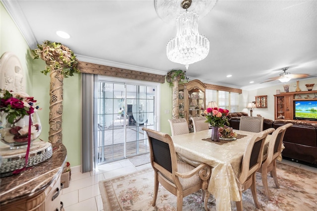 dining area with ornamental molding, light tile patterned flooring, and ceiling fan with notable chandelier