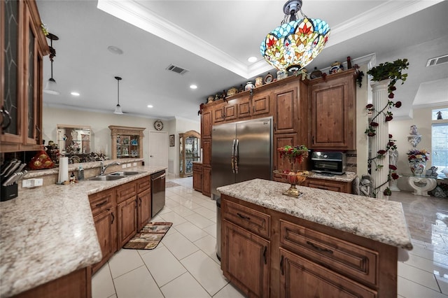 kitchen with an inviting chandelier, dishwasher, sink, a kitchen island, and pendant lighting