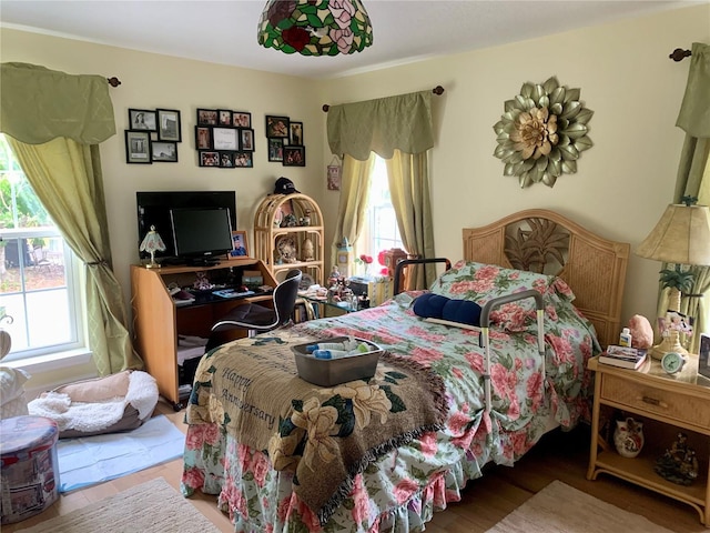 bedroom with wood-type flooring