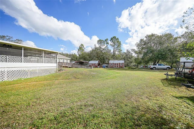 view of yard with a sunroom