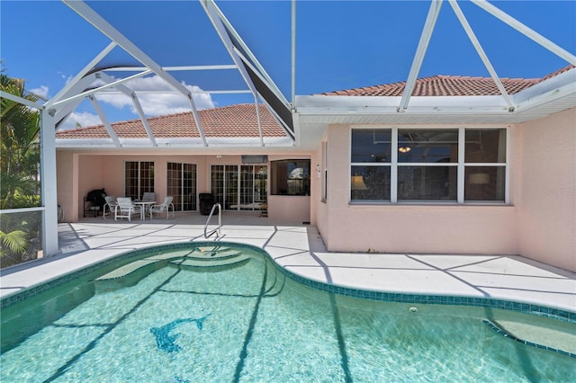 view of pool featuring a lanai and a patio area