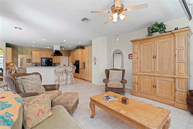 tiled living room featuring ceiling fan