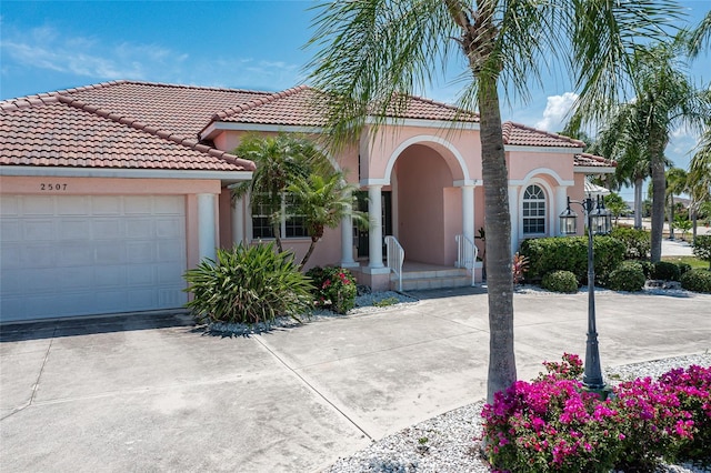 mediterranean / spanish-style house featuring a garage