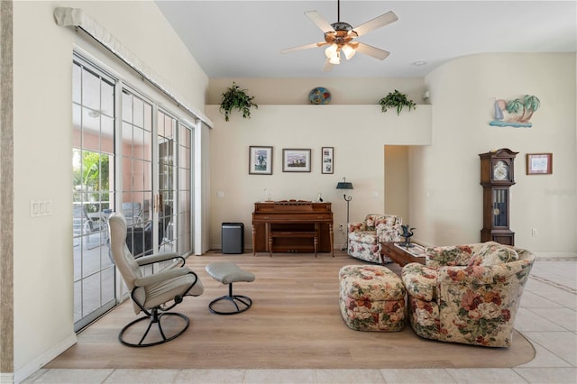 sitting room with light wood-type flooring and ceiling fan