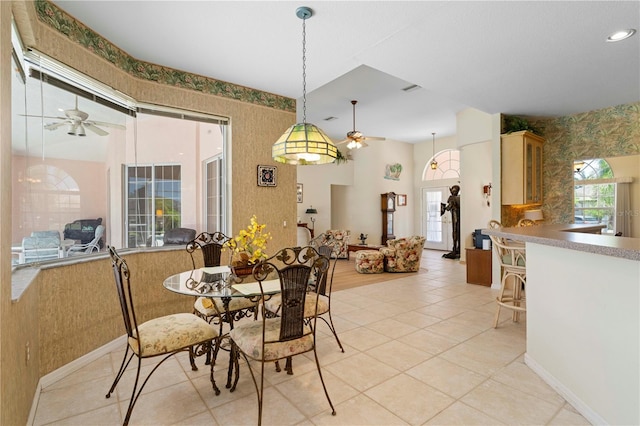 tiled dining room with ceiling fan