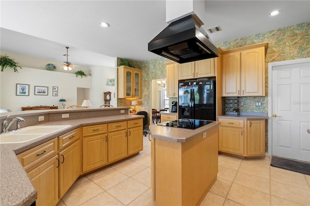 kitchen with island range hood, black appliances, sink, a kitchen island, and light brown cabinets