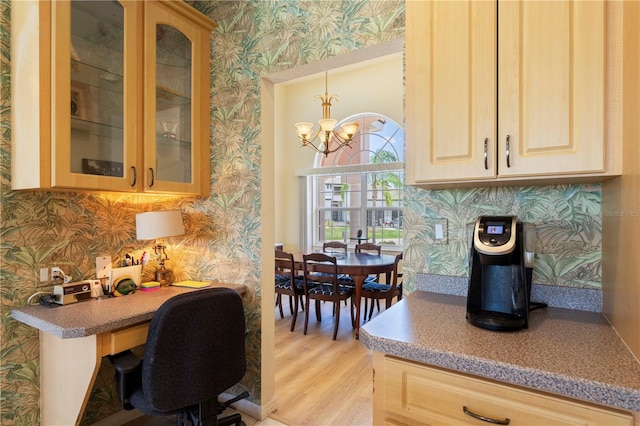 interior space featuring light hardwood / wood-style flooring and a notable chandelier